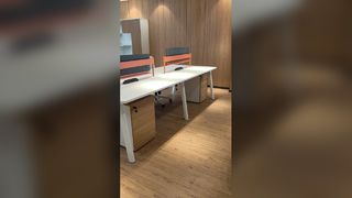 A minimalist desk for a team of four